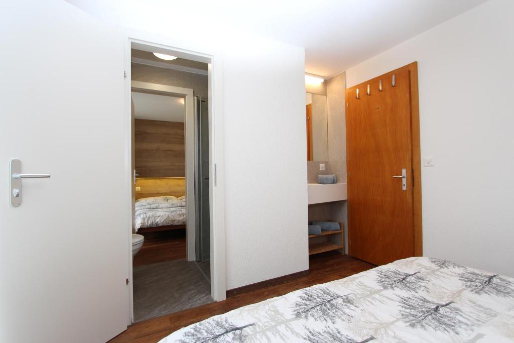 Postel nebo postele na pokoji v ubytování Haus Primavera