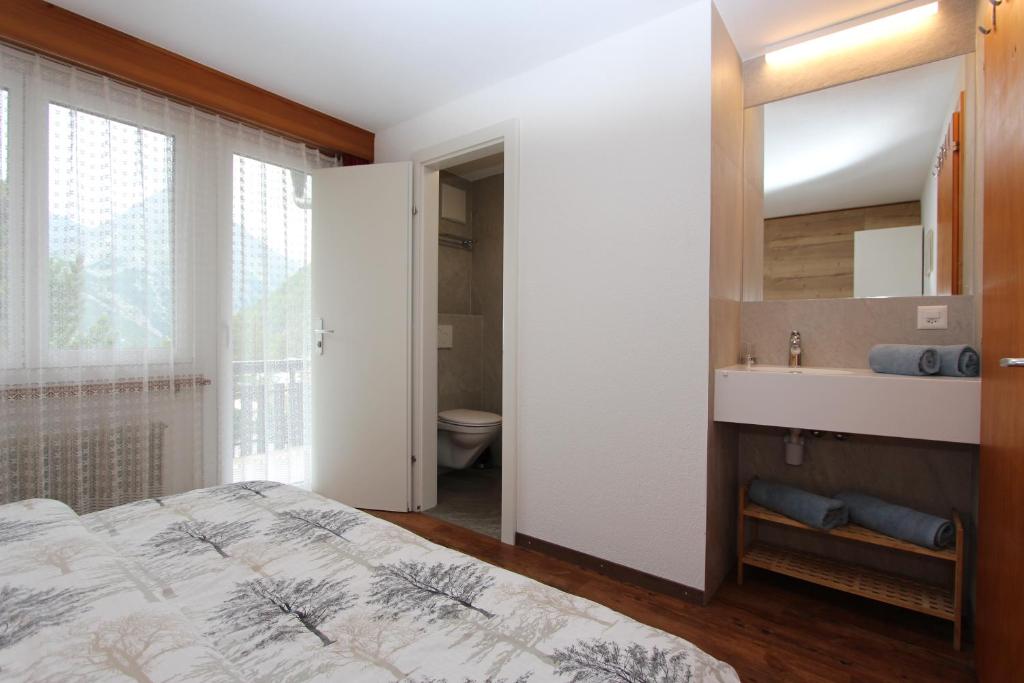 Postel nebo postele na pokoji v ubytování Haus Primavera
