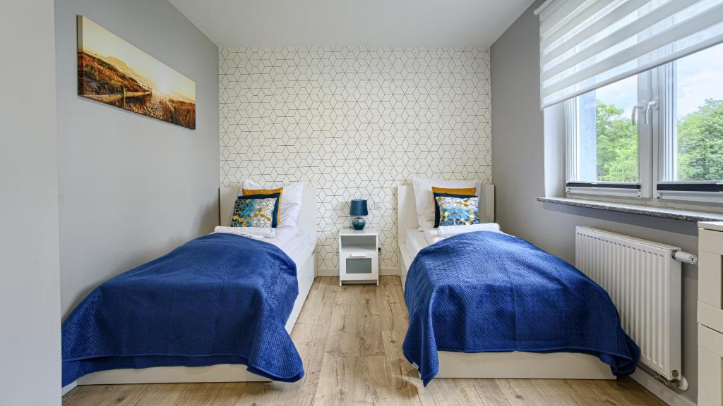 Posteľ alebo postele v izbe v ubytovaní Prywatne apartamenty Sun & Snow w Porta Mare