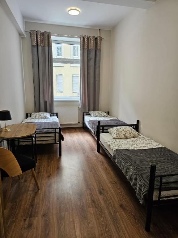 Postel nebo postele na pokoji v ubytování Hostel KASZUBSKA