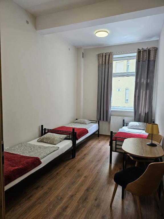 Postel nebo postele na pokoji v ubytování Hostel KASZUBSKA