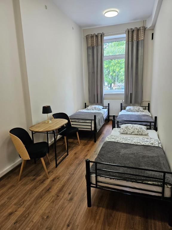 Postel nebo postele na pokoji v ubytování Hostel KASZUBSKA