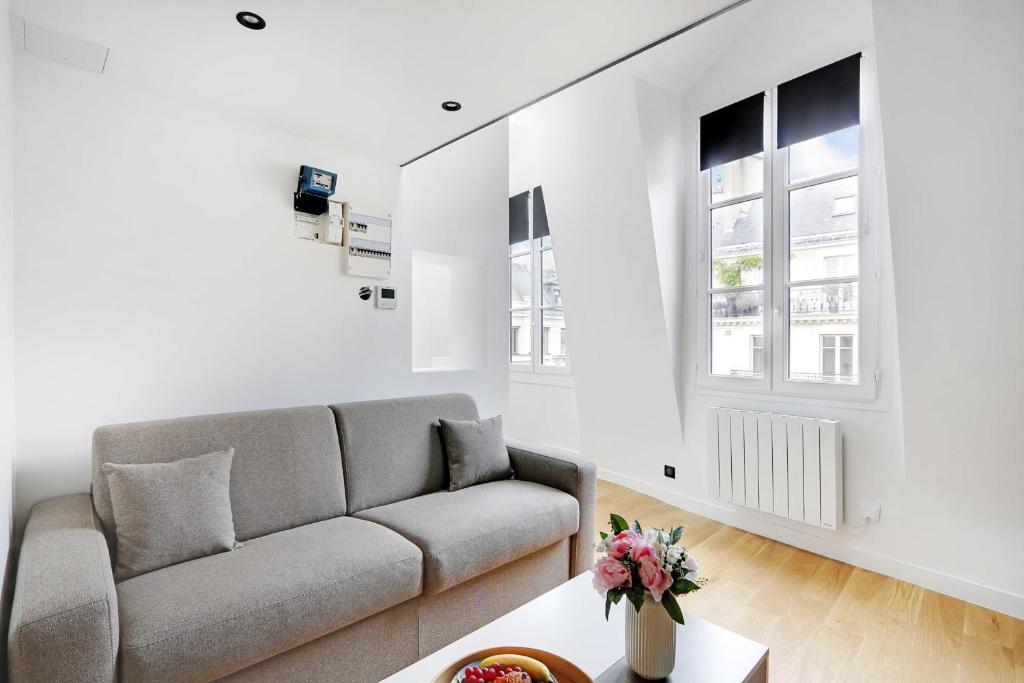 Area tempat duduk di Cosy renovated 1BDR on rue des Archives Marais Clim 5