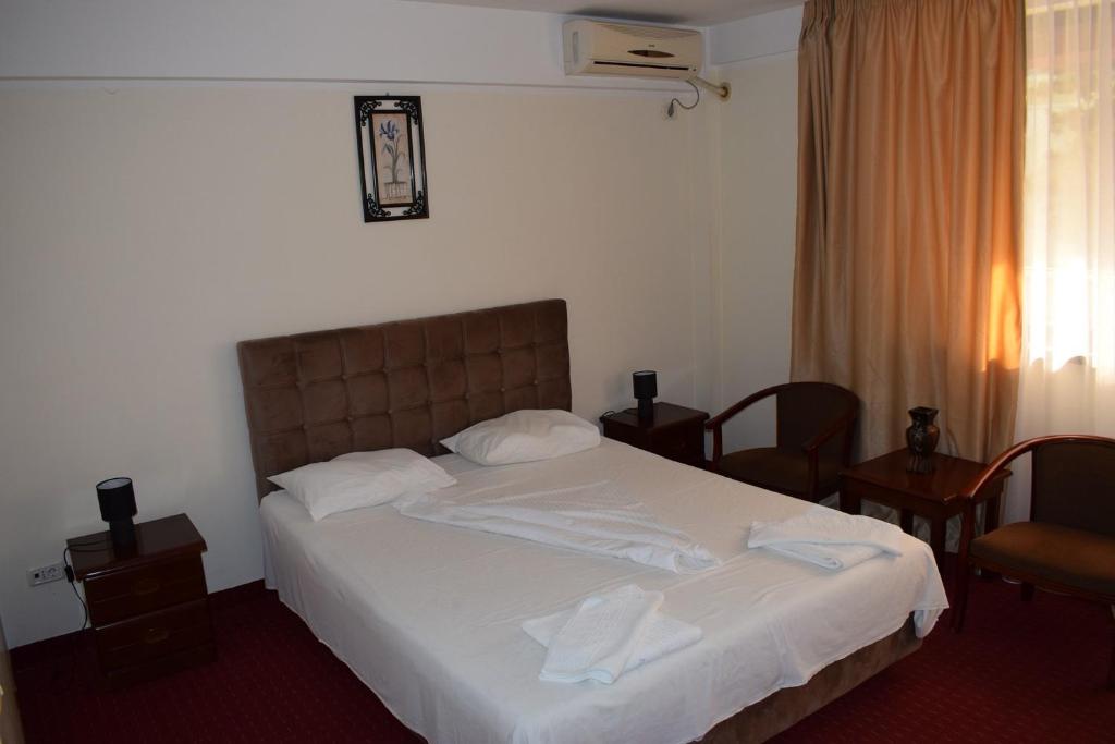Postel nebo postele na pokoji v ubytování Hotel Ibiza
