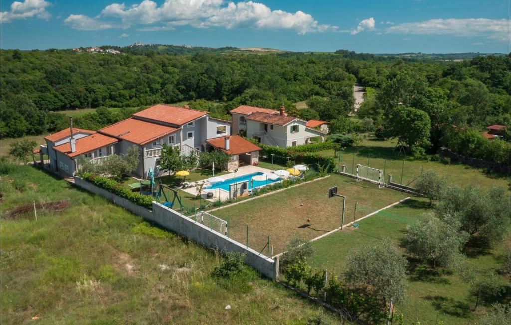 an aerial view of a house with a swimming pool at Nice Home In Buje With Outdoor Swimming Pool in Buje