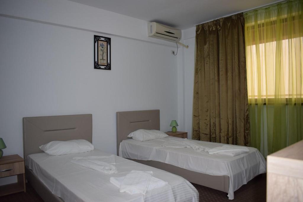 Postel nebo postele na pokoji v ubytování Hotel Ibiza