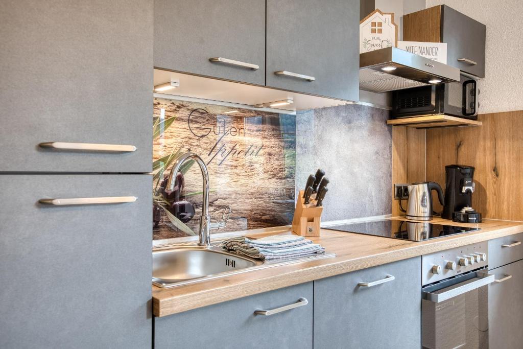 Kuchyň nebo kuchyňský kout v ubytování Chill Out Apartments
