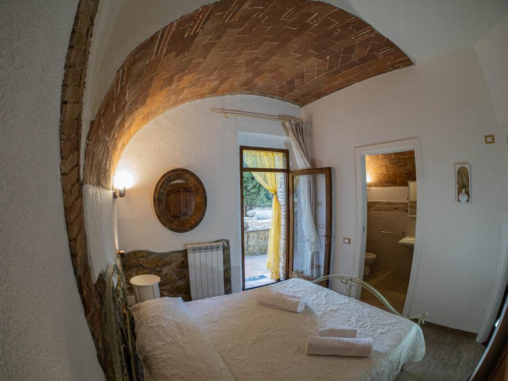 Postel nebo postele na pokoji v ubytování Podere Mona