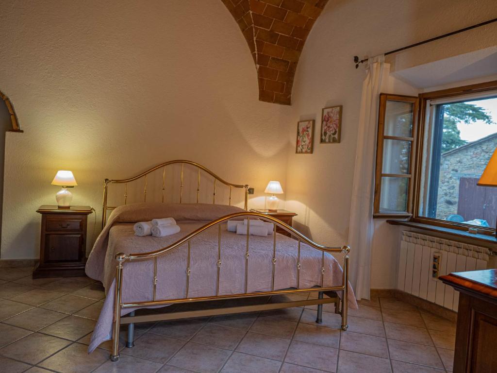 Postel nebo postele na pokoji v ubytování Podere Mona