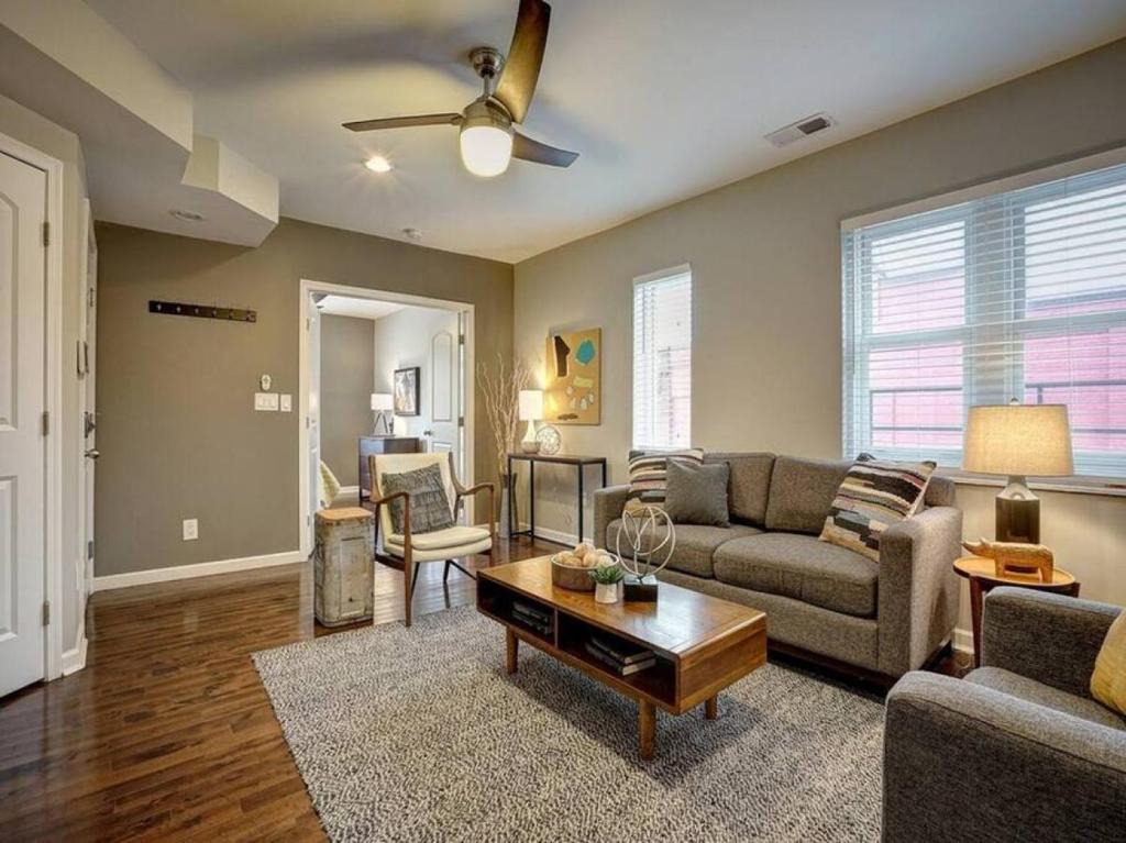 a living room with a couch and a table at Bright 2BR near downtown in Cincinnati