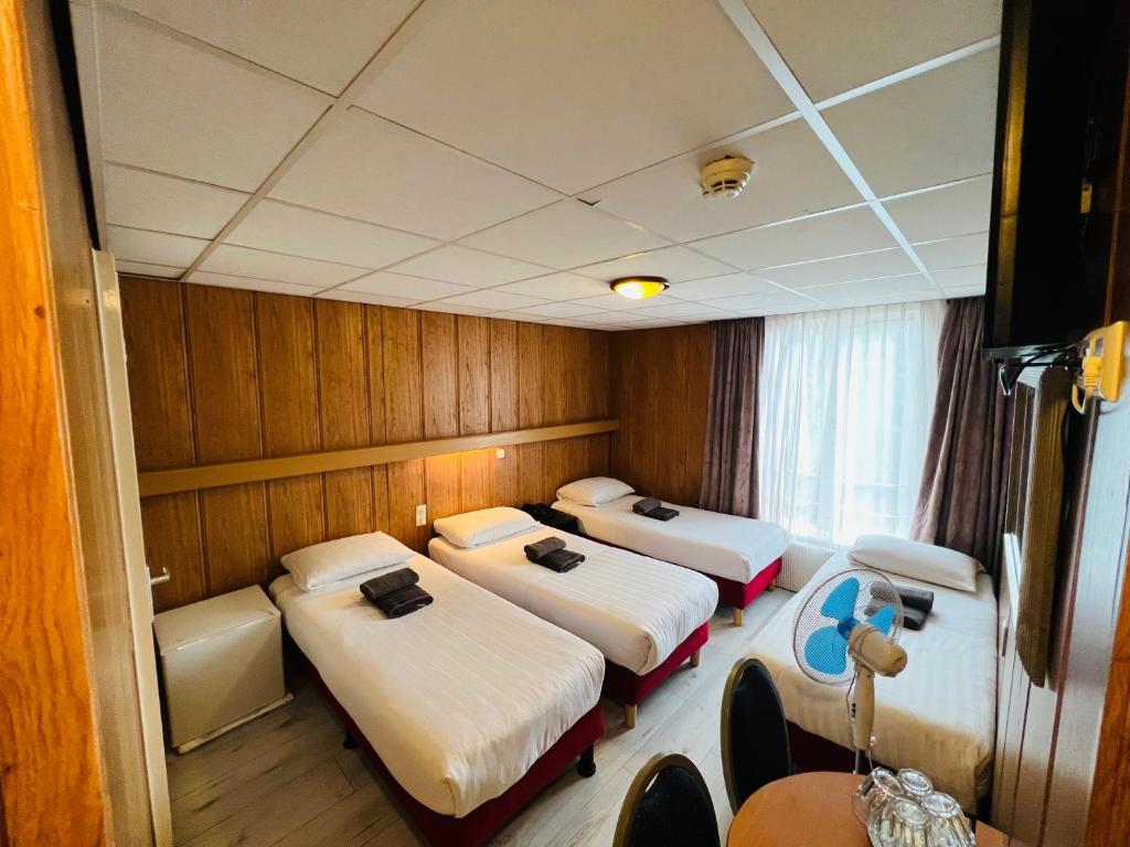 Postel nebo postele na pokoji v ubytování Hotel Sharm