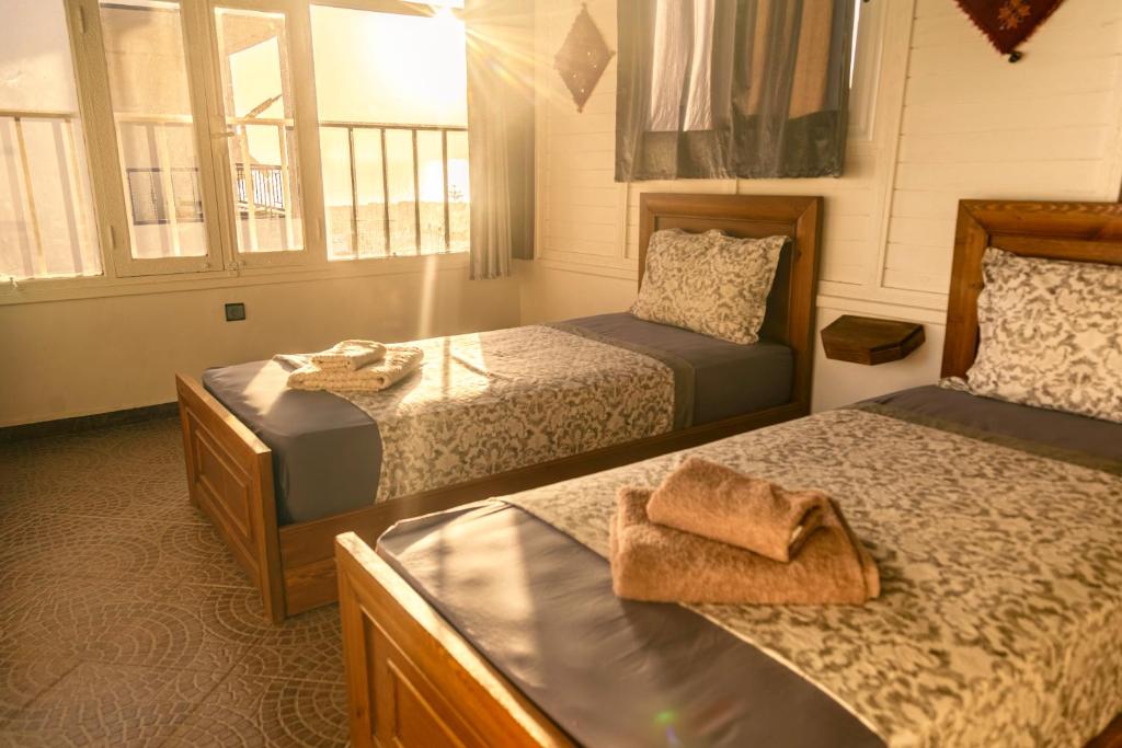 a bedroom with two beds at The Rina Hostel in Agadir