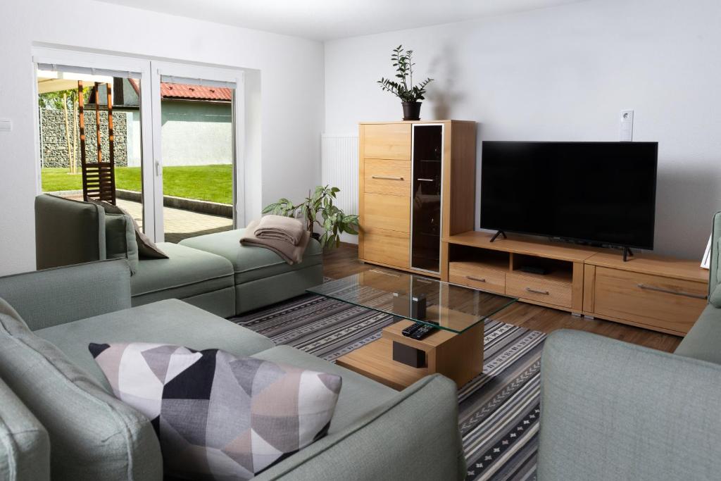 TV a/nebo společenská místnost v ubytování Stylish apartment under the Tatras