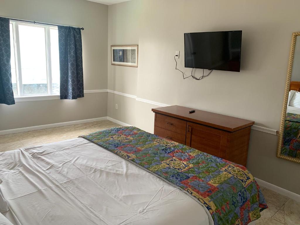 Postel nebo postele na pokoji v ubytování Paradise Inn