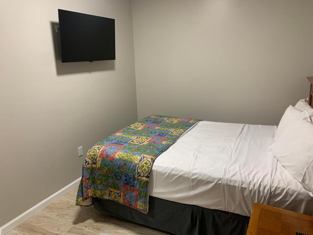 Postel nebo postele na pokoji v ubytování Paradise Inn