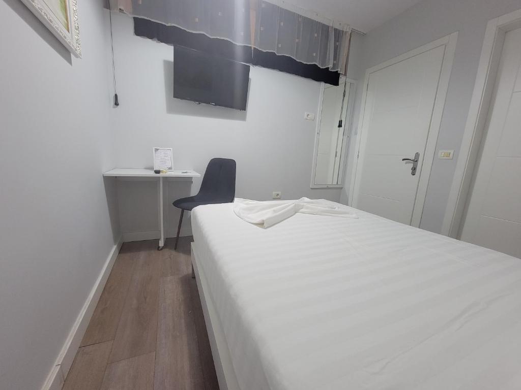 Postel nebo postele na pokoji v ubytování Nuestra Casa