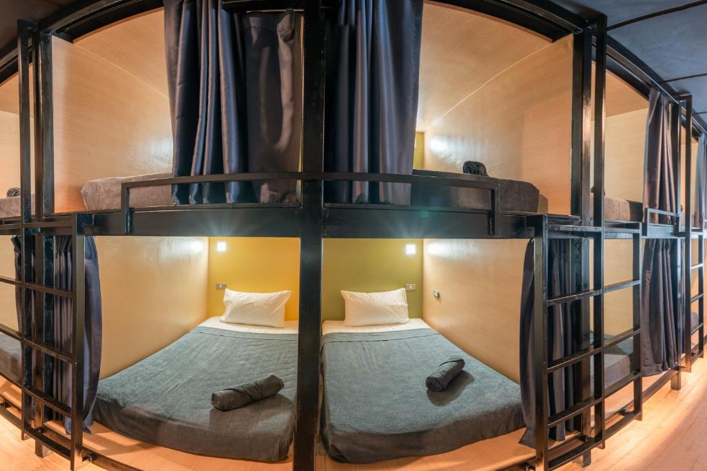 Postel nebo postele na pokoji v ubytování Black Panther Hostel
