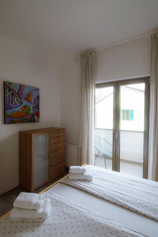 Postel nebo postele na pokoji v ubytování Apartment Nike