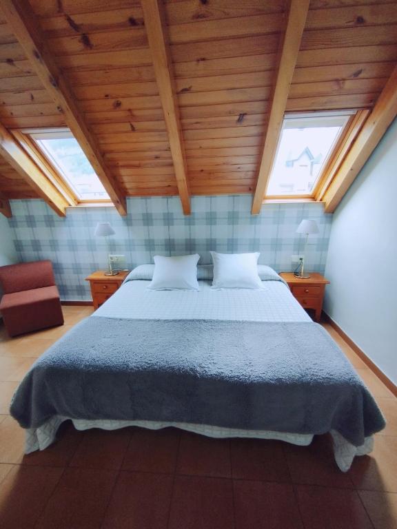 Postel nebo postele na pokoji v ubytování Hotel Ostau d'Òc