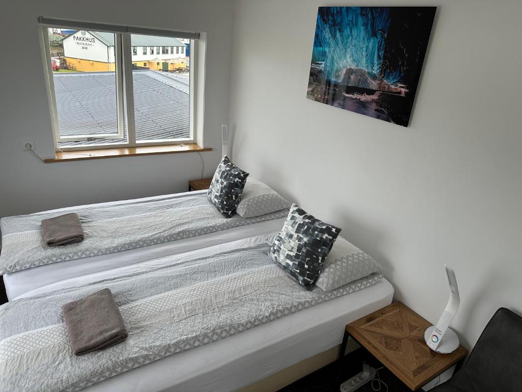 Postel nebo postele na pokoji v ubytování Guesthouse Dyngja