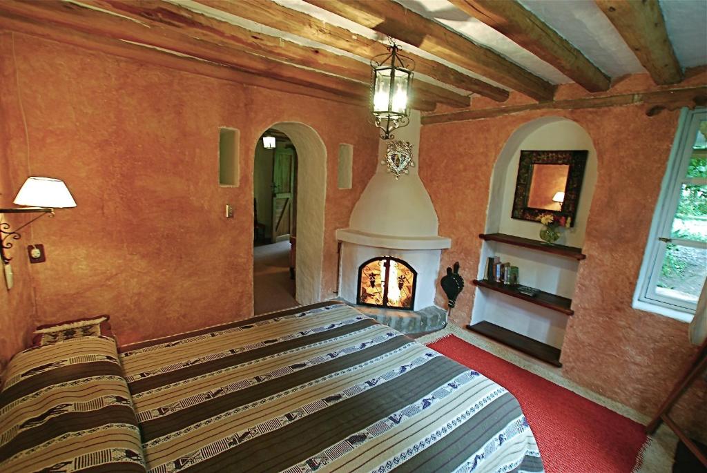 Postel nebo postele na pokoji v ubytování Hacienda Cusin