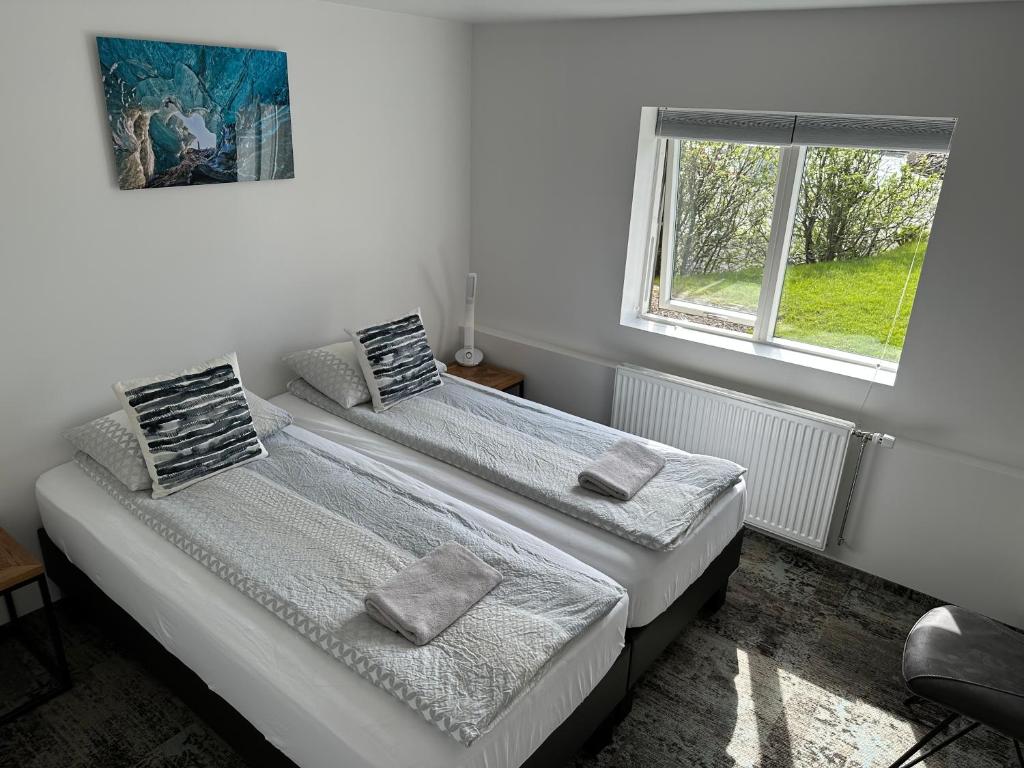 Postel nebo postele na pokoji v ubytování Guesthouse Dyngja