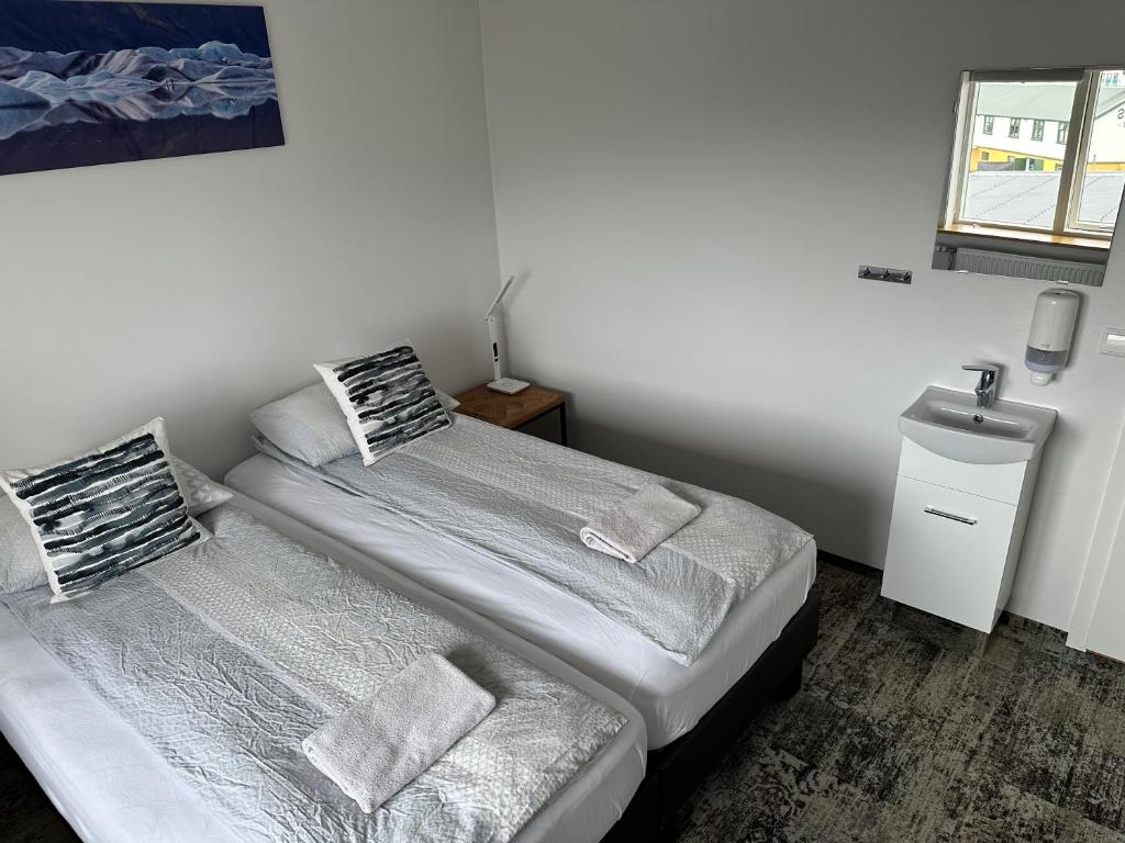 Postel nebo postele na pokoji v ubytování Guesthouse Dyngja