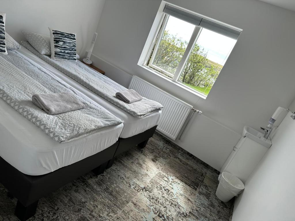 Postel nebo postele na pokoji v ubytování Guesthouse Dyngja