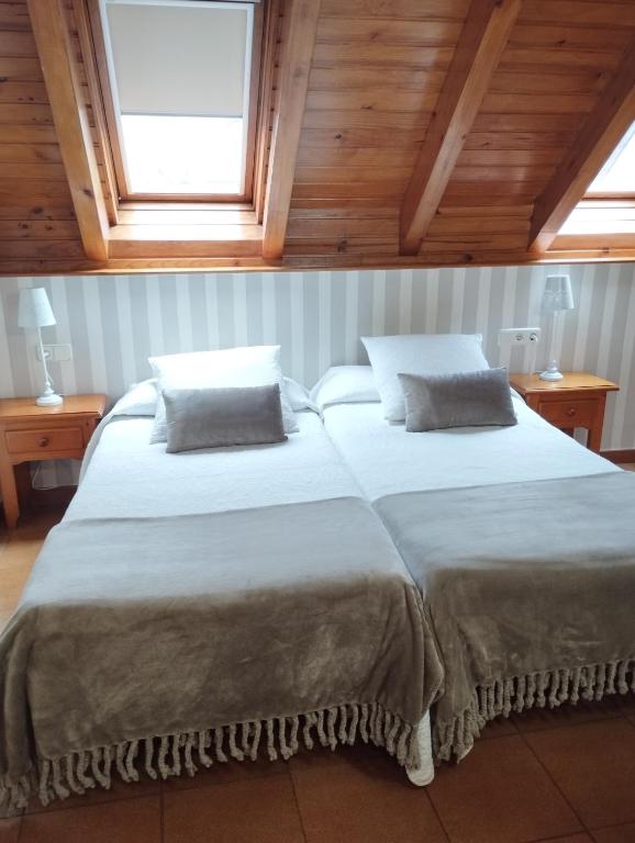 Postel nebo postele na pokoji v ubytování Hotel Ostau d'Òc