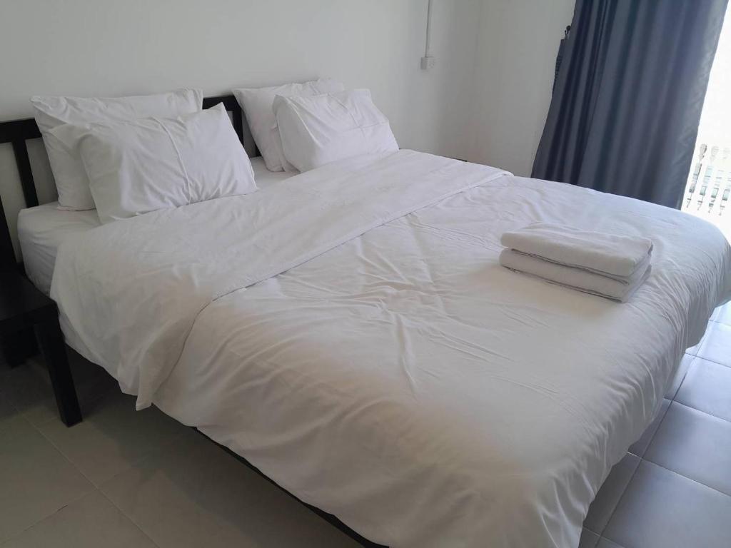 Postel nebo postele na pokoji v ubytování GO INN HuaHin โกอินน์ หัวหิน