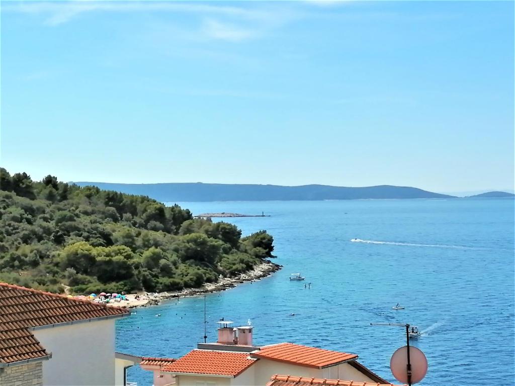 a view of a body of water with houses at Apartment Azuri in Okrug Donji