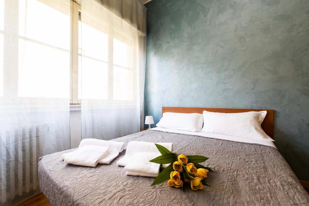 Een bed of bedden in een kamer bij Garibaldi - Exclusive Apartment