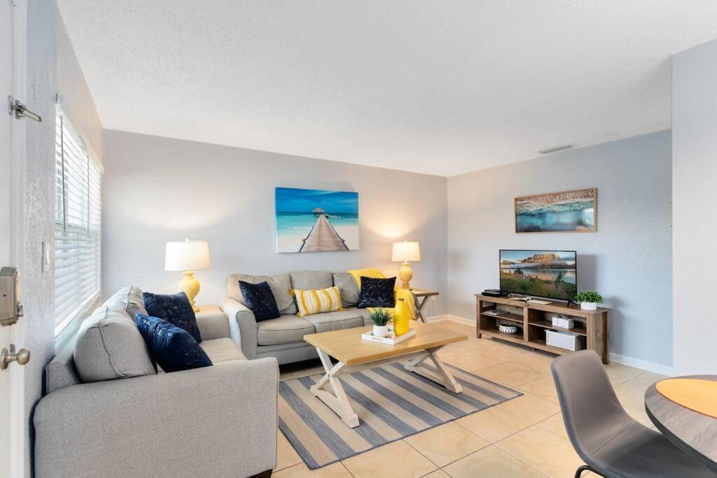 a living room with a couch and a table at Beachside 16 in Indian Harbour Beach