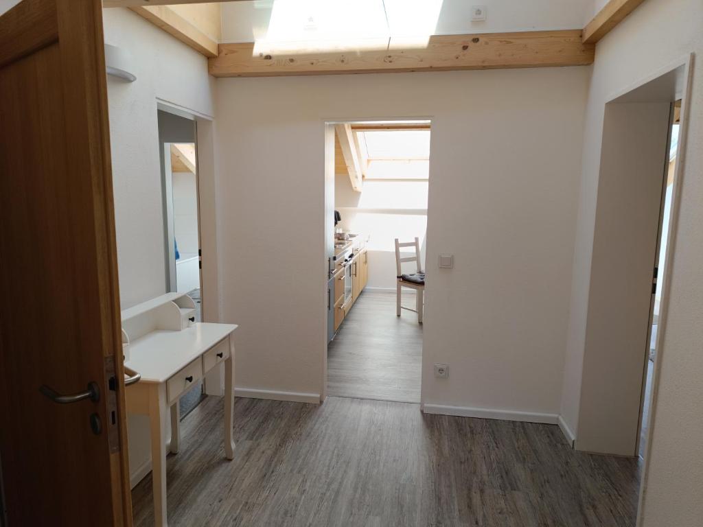 a bathroom with a sink and a mirror at Apartment unterm Dach mit kleinem Seeblick in Münsing am Starnberger See