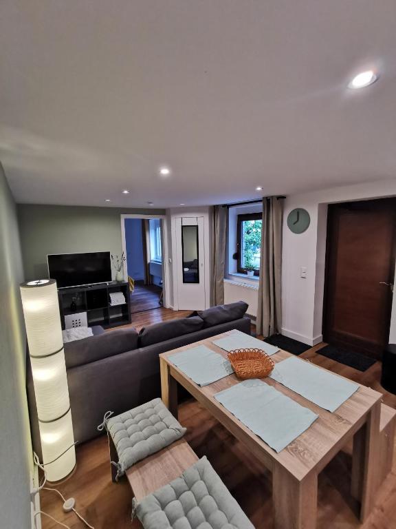 a living room with a couch and a table at Apartment Viola in Meiningen