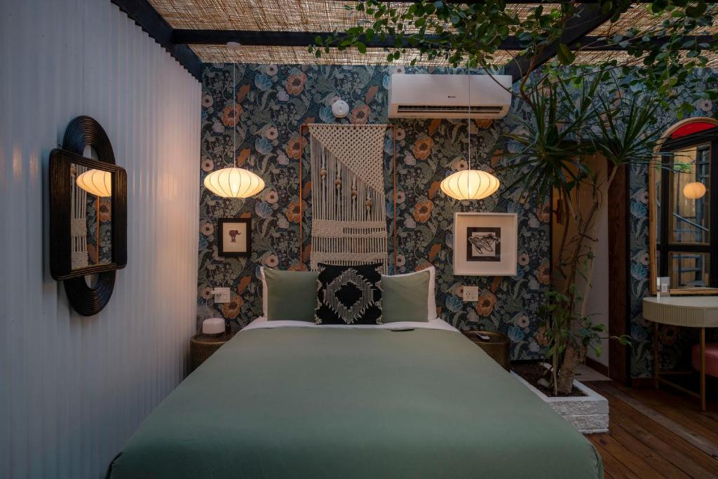 Postel nebo postele na pokoji v ubytování La Botanica Hotel