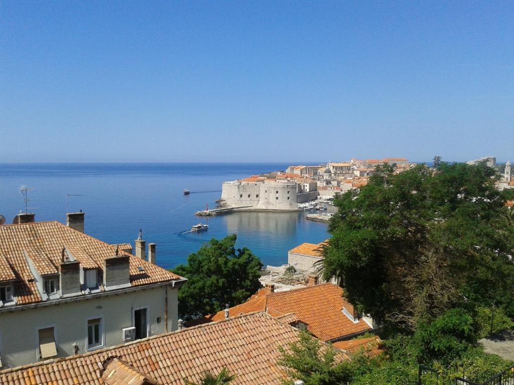 a view of a city and the ocean with buildings at Apartment Melita in Dubrovnik