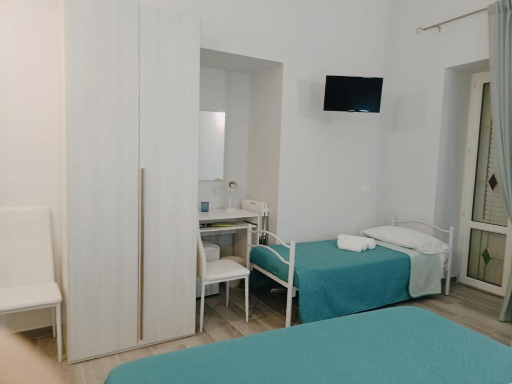 Postel nebo postele na pokoji v ubytování Le vie del centro