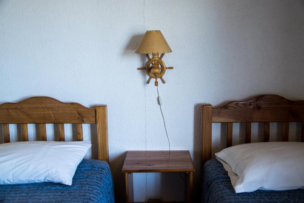 Postel nebo postele na pokoji v ubytování Hostal Mundo Nuevo