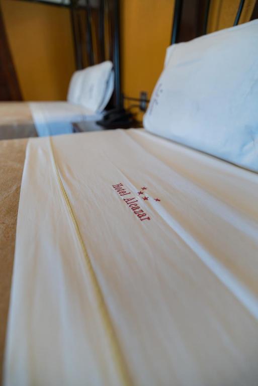 Postel nebo postele na pokoji v ubytování Hotel Alcazar - Guadalajara Centro Historico
