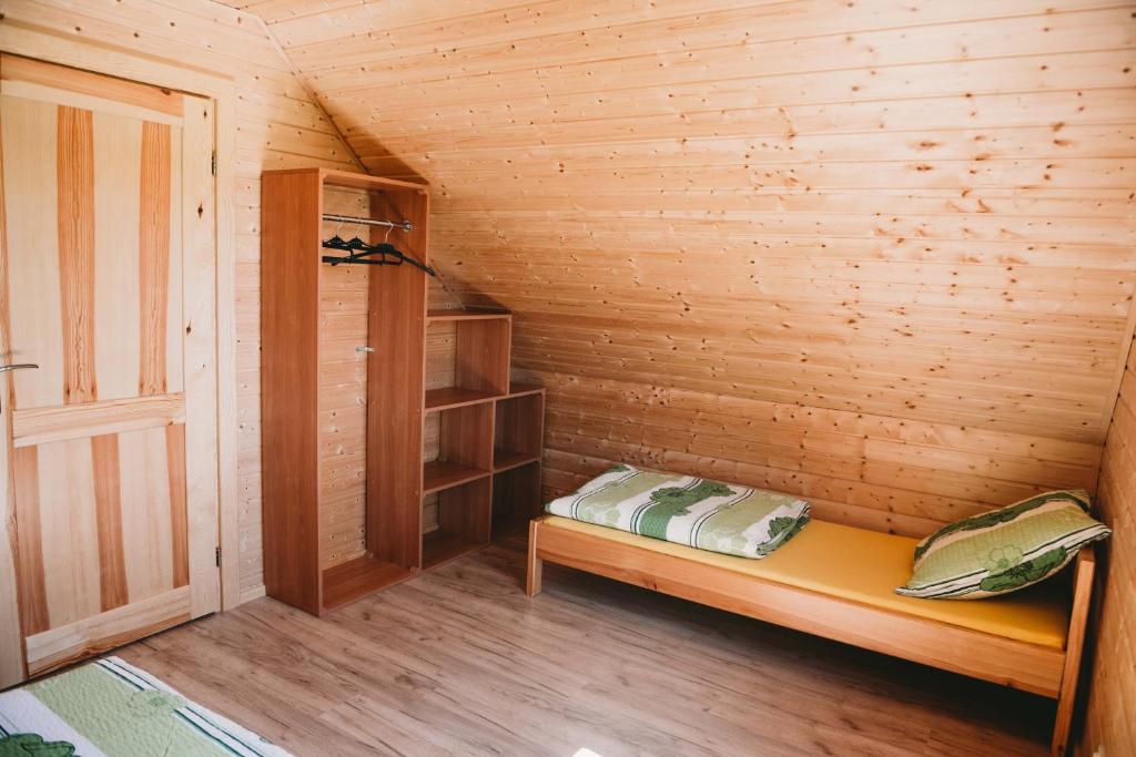 Postel nebo postele na pokoji v ubytování Domki U Edzia