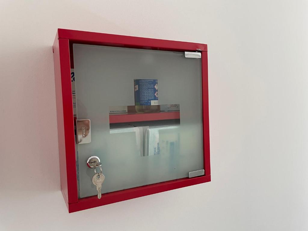 a red glass window with a key in it at Villa de standing in Calvi