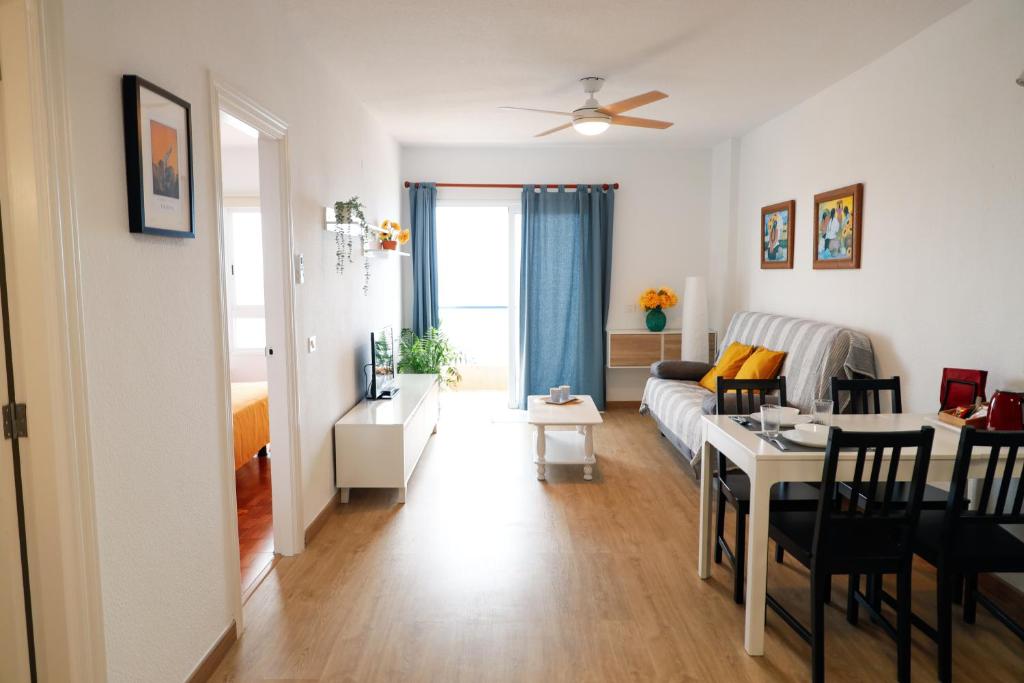 a living room with a couch and a table at Apartamento Maye in Bajamar
