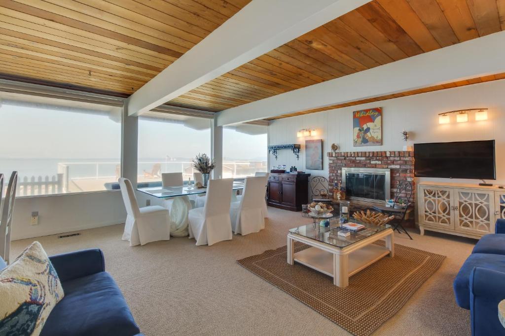 a living room with a couch and a table at West Beach Retreat in Oak Harbor