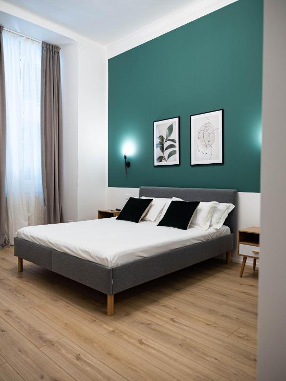 Postel nebo postele na pokoji v ubytování Moor Assarotti Suites - Genova City Center