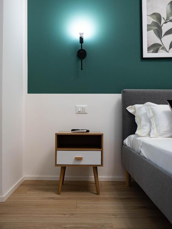 Postel nebo postele na pokoji v ubytování Moor Assarotti Suites - Genova City Center