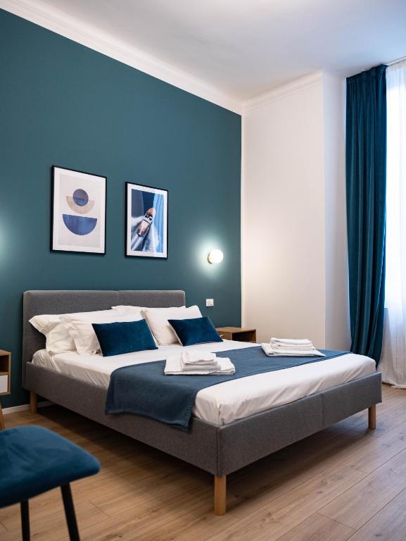 Postel nebo postele na pokoji v ubytování Moor Assarotti Suites - Genova City Center