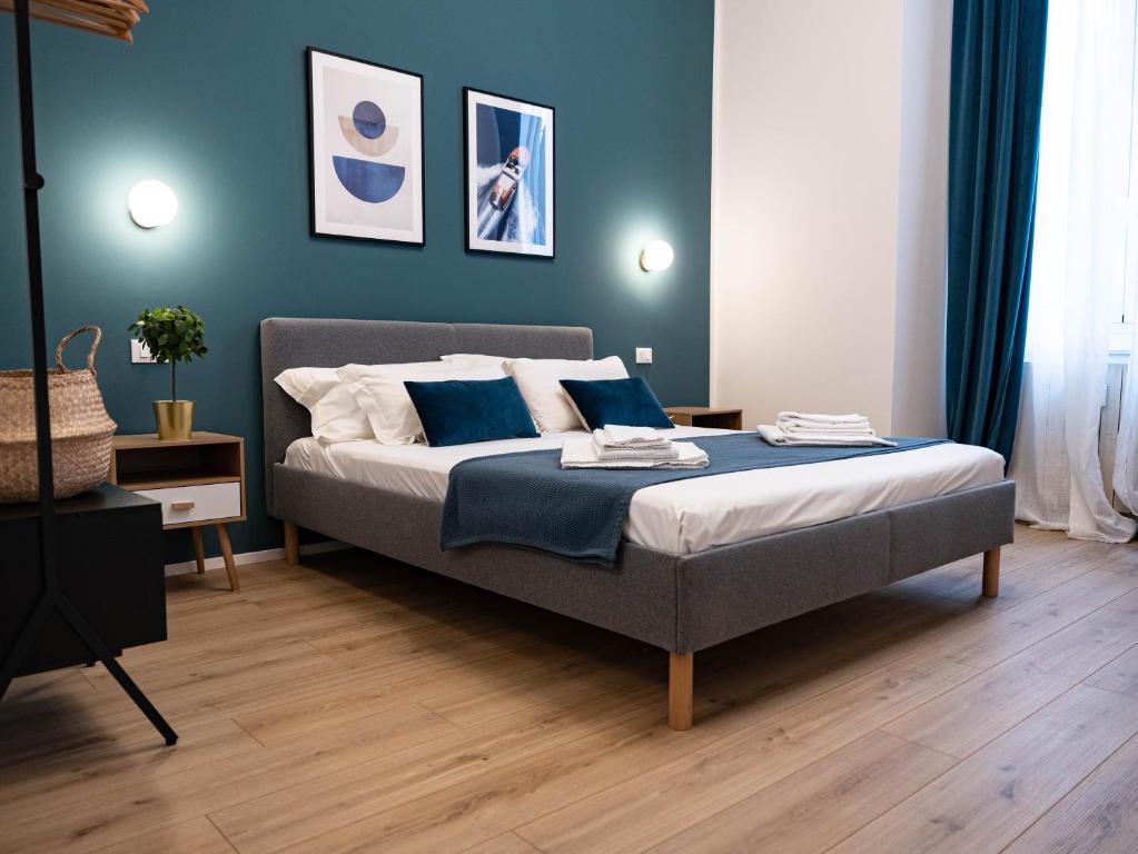 Postel nebo postele na pokoji v ubytování Moor Assarotti Suites - Genova City Center
