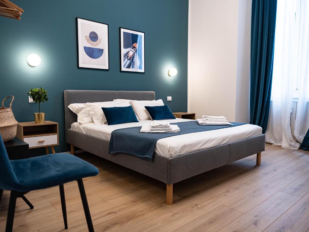 Postel nebo postele na pokoji v ubytování Moor Assarotti Suites - Genova City Center