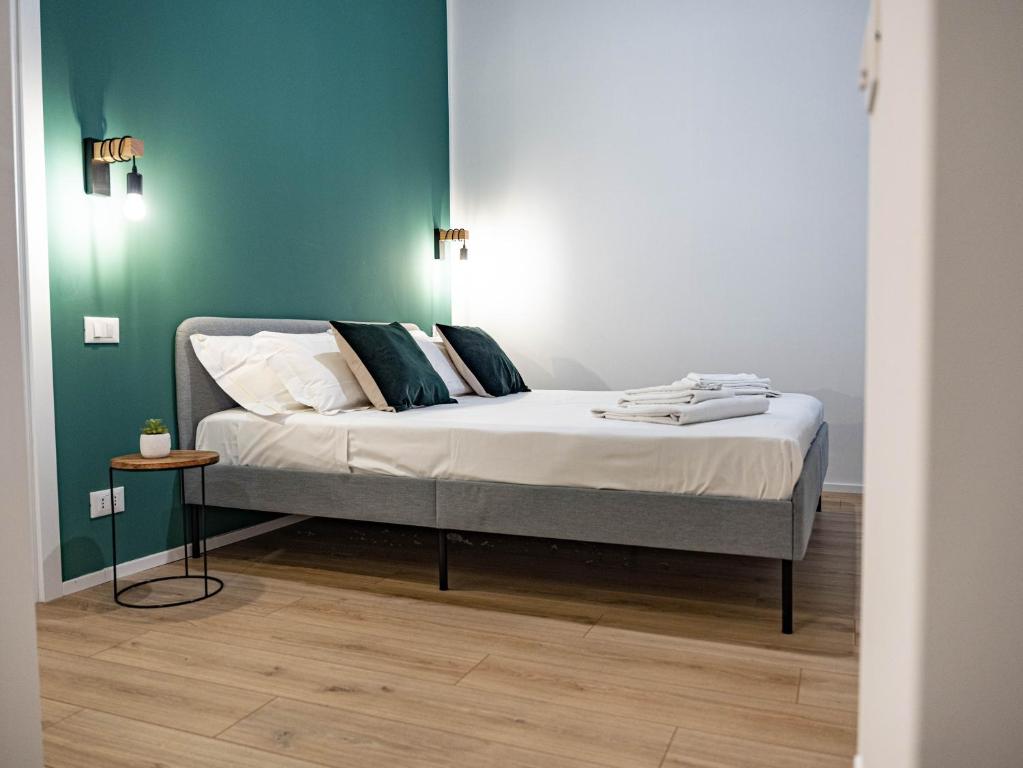 Postel nebo postele na pokoji v ubytování Moor Assarotti Suites - Genova City Center